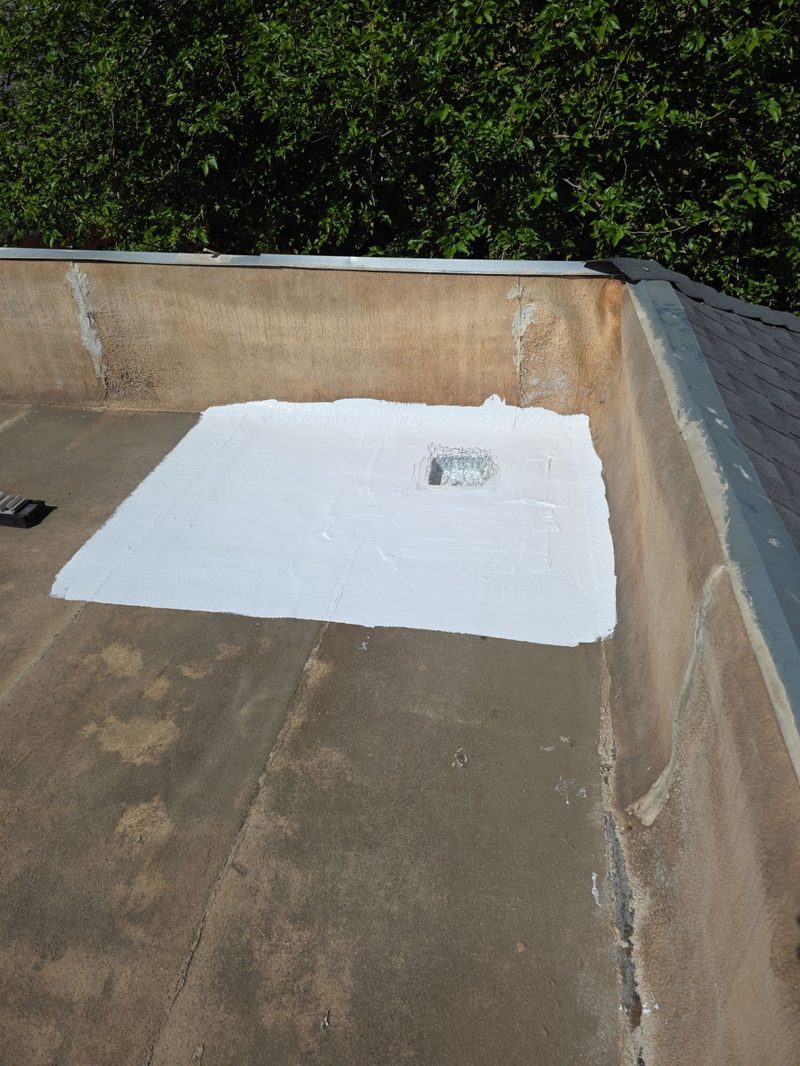 Close-up of completed drain repair with heat-welded membrane patch on Modesto flat roof