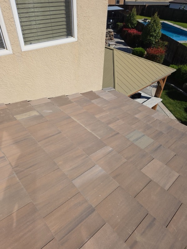 Wide view of completed tile roof repair in Livingston